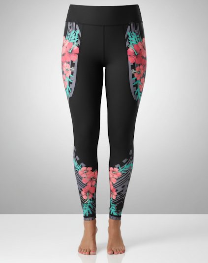Women's hibiscus tights with island-inspired print, front phone pockets, and back zipper pocket made from nylon/spandex and polyester.