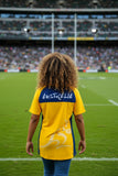 Woman wearing official Wallabies BlueGold Jersey with Australia text on back